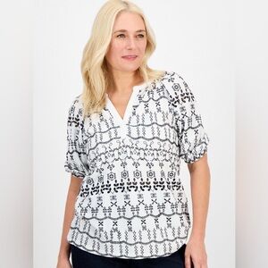 Style & Co® charming split neck top with a sweet eyelet design,
